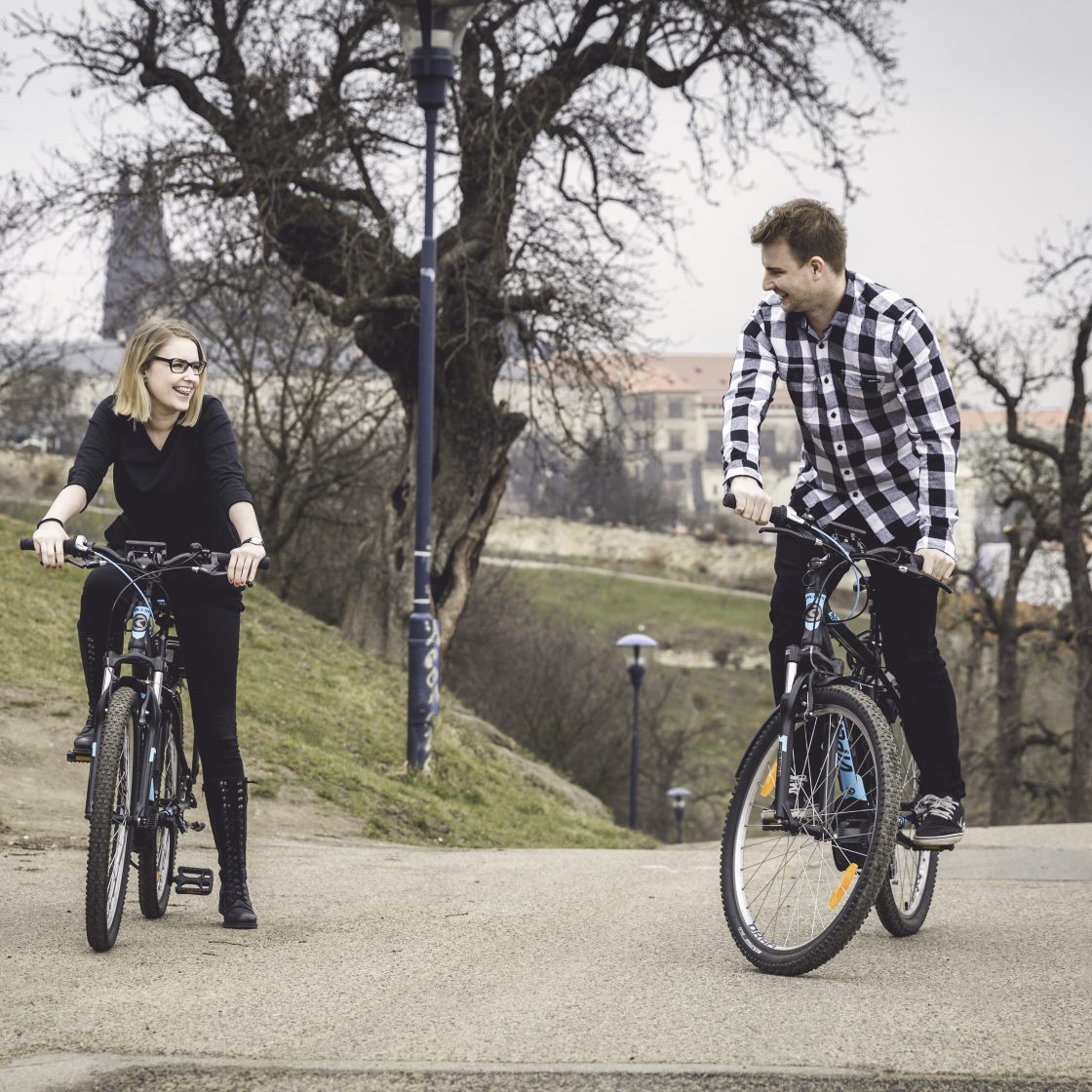 Couple on Petrin hill in Prague on electric bikes